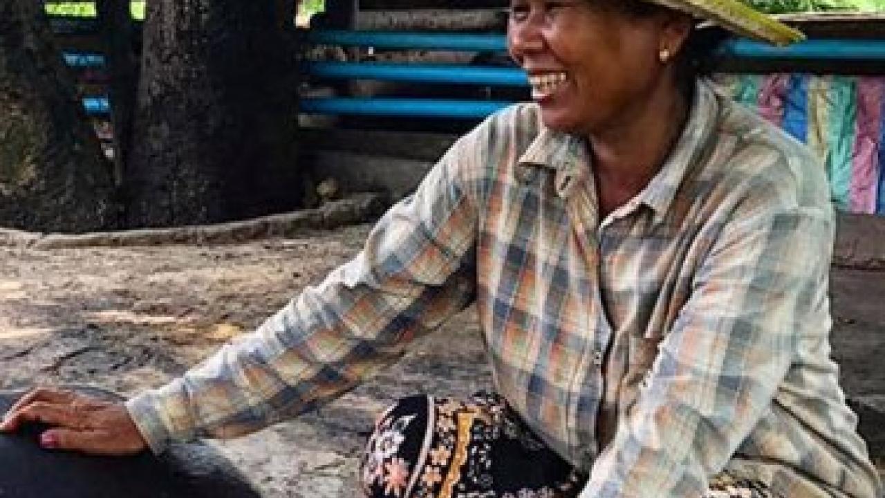Cambodian farmer with pig